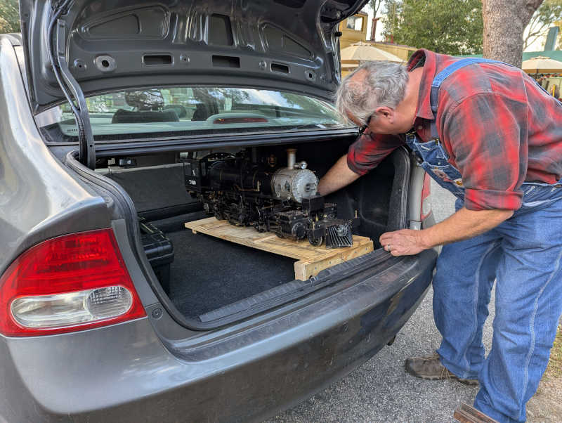 Boschan&rsquo;s 2-4-4-2 being loaded into Honda Civic trunk